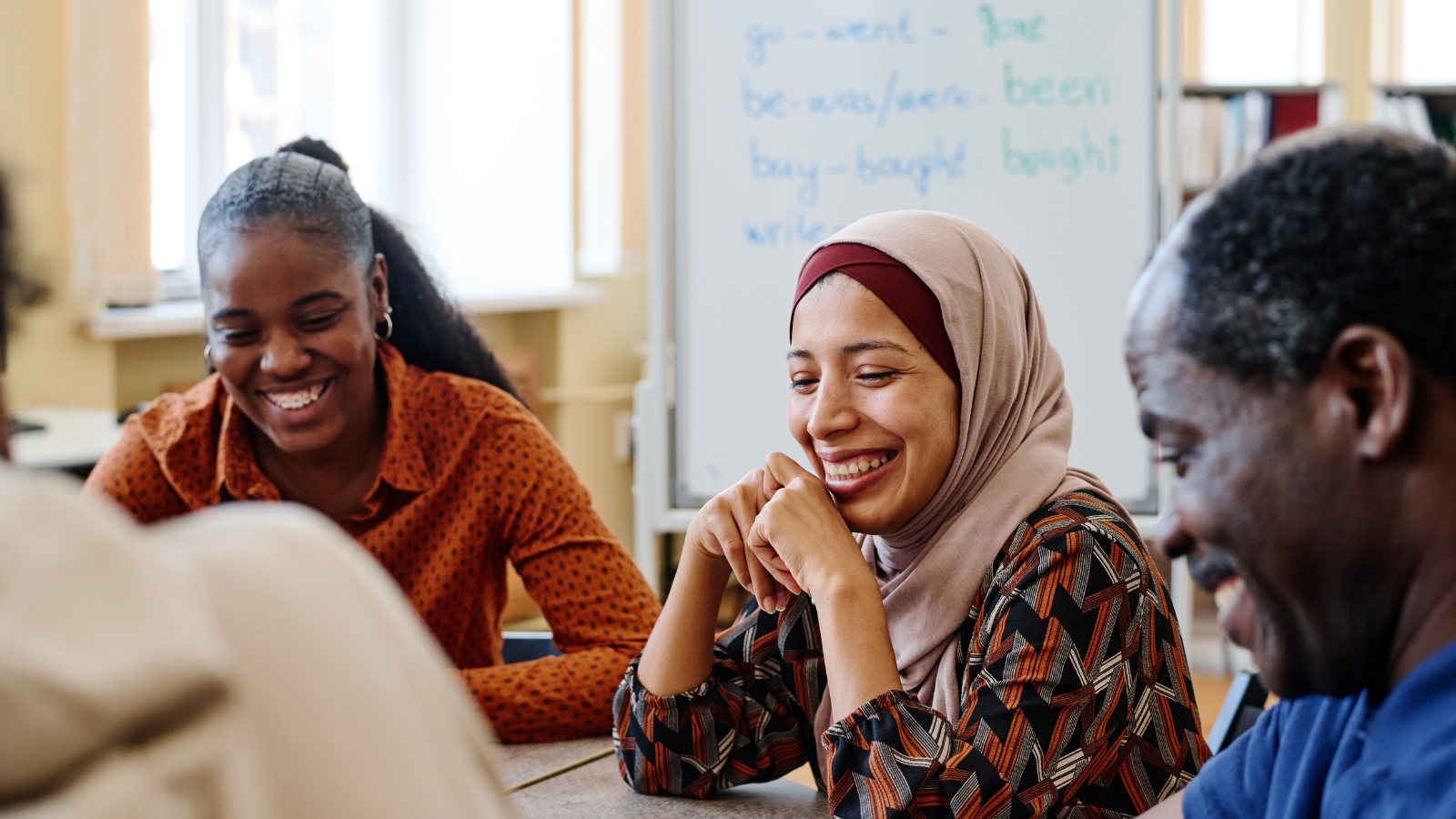 An English class in session around a shared table