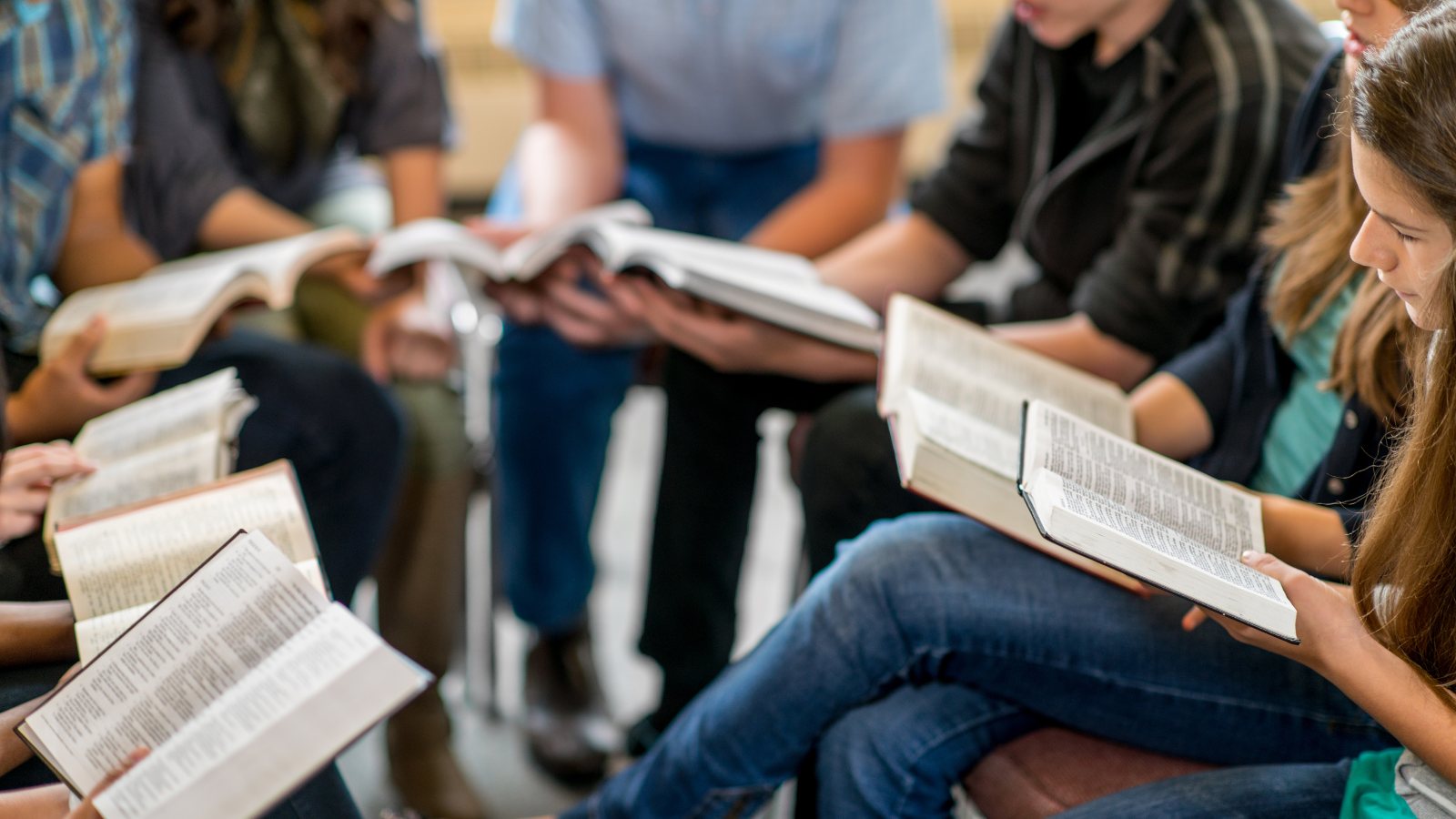 A group sitting together with open Bibles